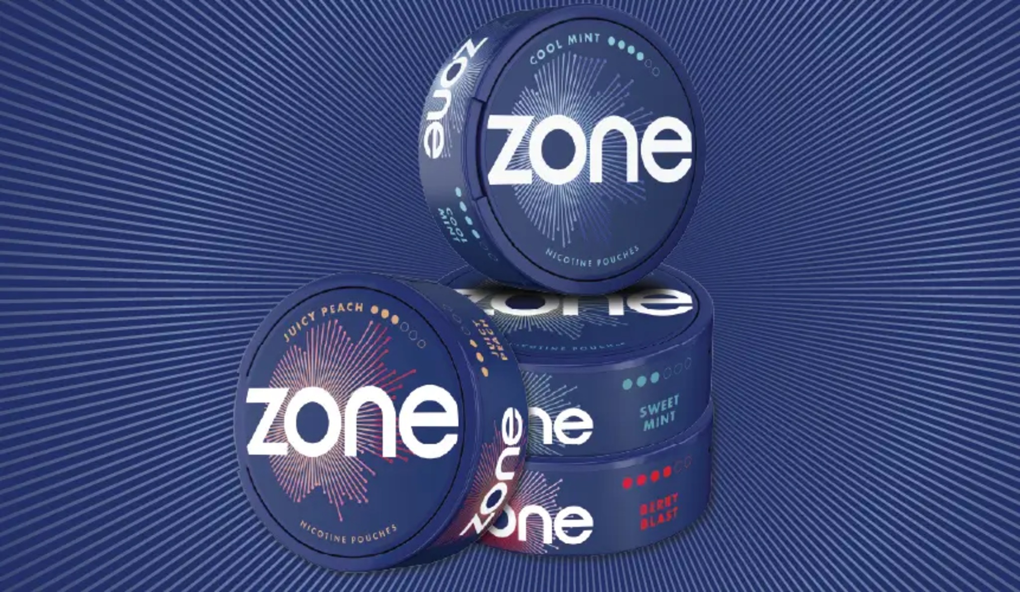 Four Zone cans in different flavours of nicotine pouches.